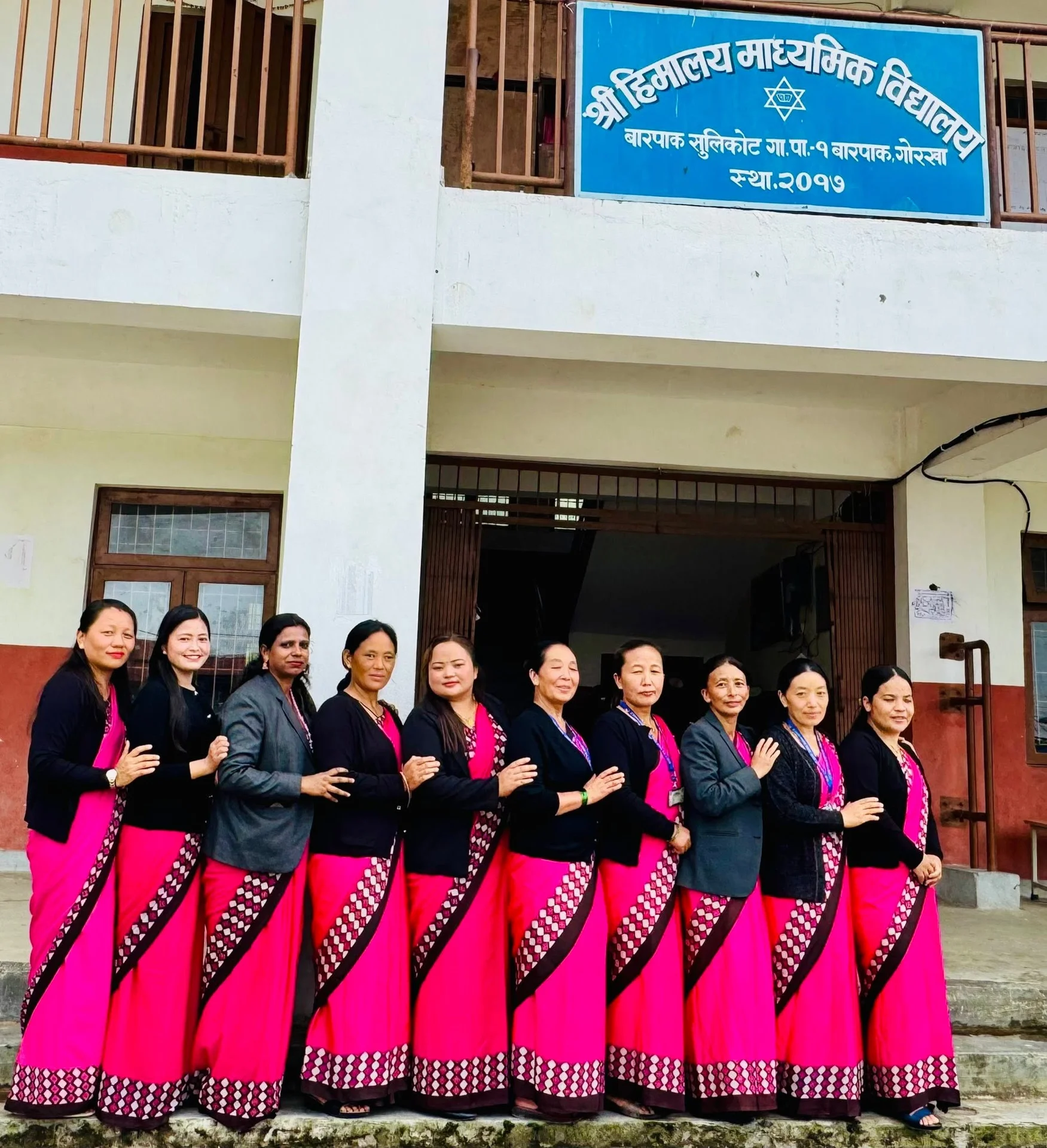 School staff in traditional attire