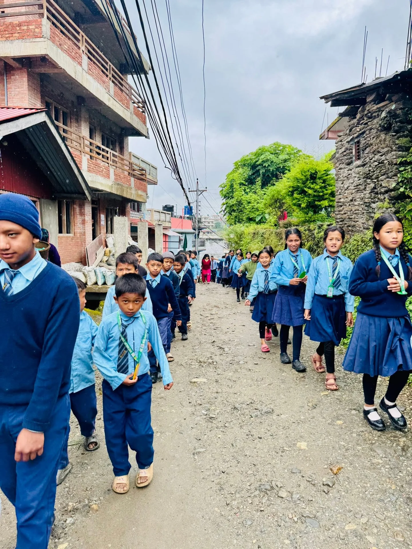 Student rally through village streets
