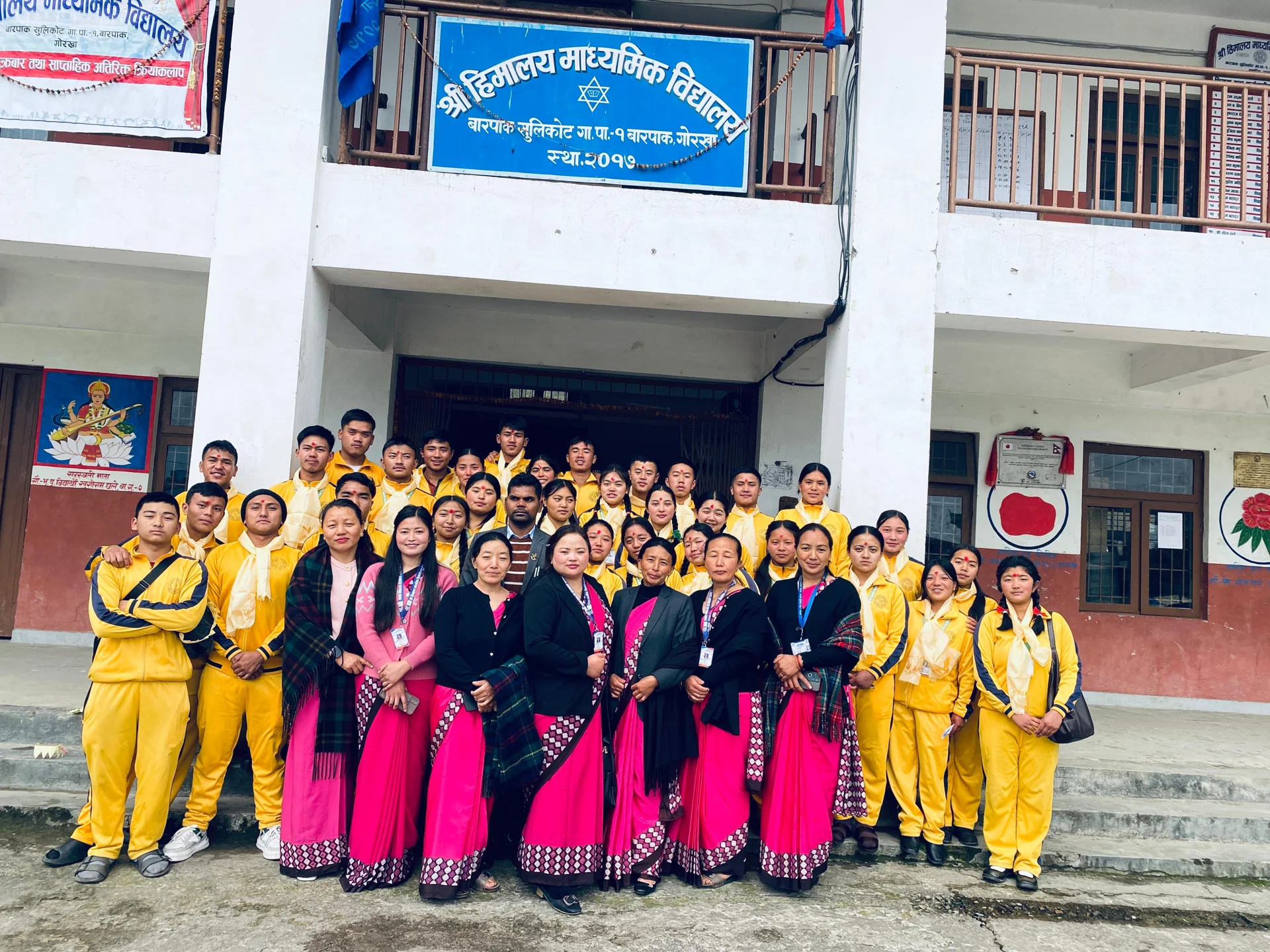 Teachers and students celebrating at school
